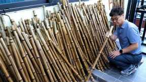 Process of making long bamboo flutes. Korean traditional musical wind instruments factory