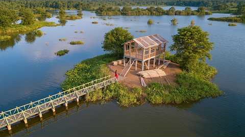 365 Days in Isolation: A girl builds a wooden house on a deserted island.| by @LyThiHoa1987